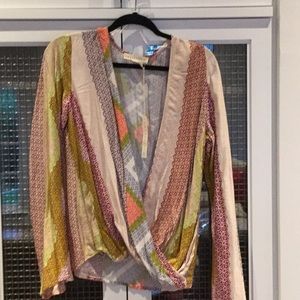 Asymmetrical faux-wrap long sleeve top